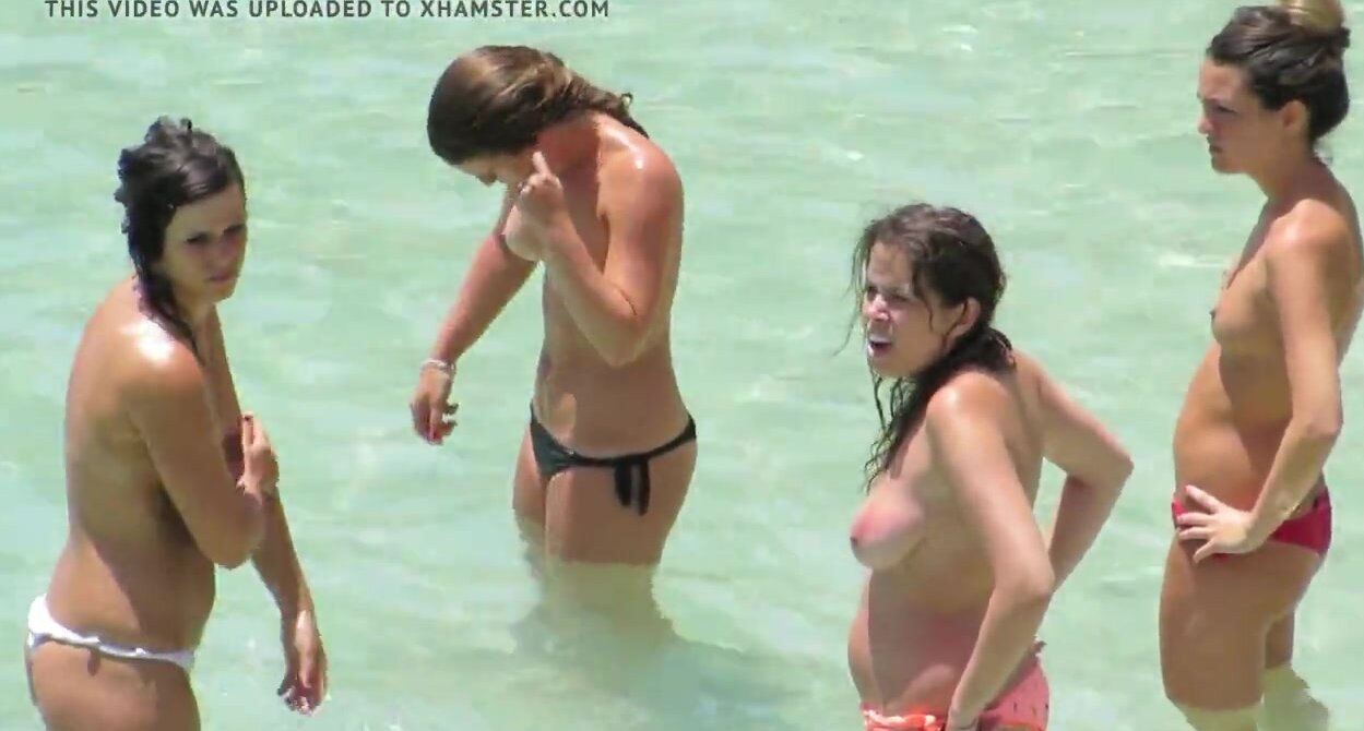 4 topless teen girls at spanish beach photo